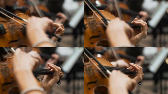 交响音乐会，一名男子演奏大提琴，手拉特写