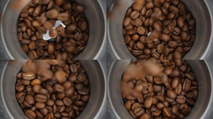 烤咖啡豆倒入咖啡研磨机。特写。
