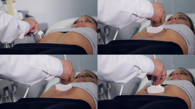 医生对腹腔进行超声检查的特写。4K。
