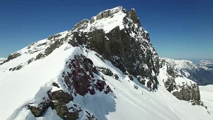 Aerial view of snow covered mountain range with be