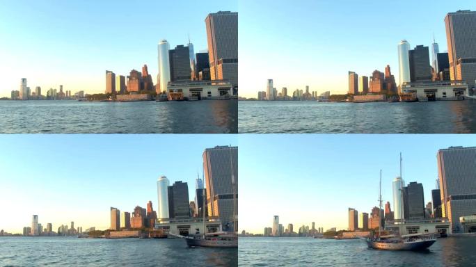 远处金色日落和新泽西的标志性曼哈顿下城天际线