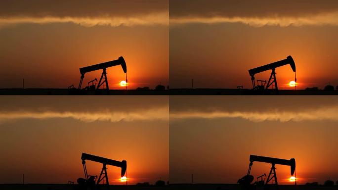 石油工业与日落黄昏中的采油机唯美意境傍晚