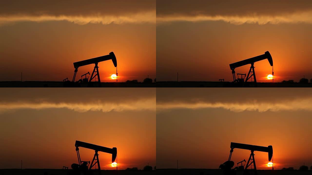 石油工业与日落黄昏中的采油机唯美意境傍晚