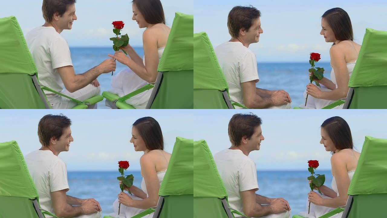 高清: 女人在海滩上收到玫瑰