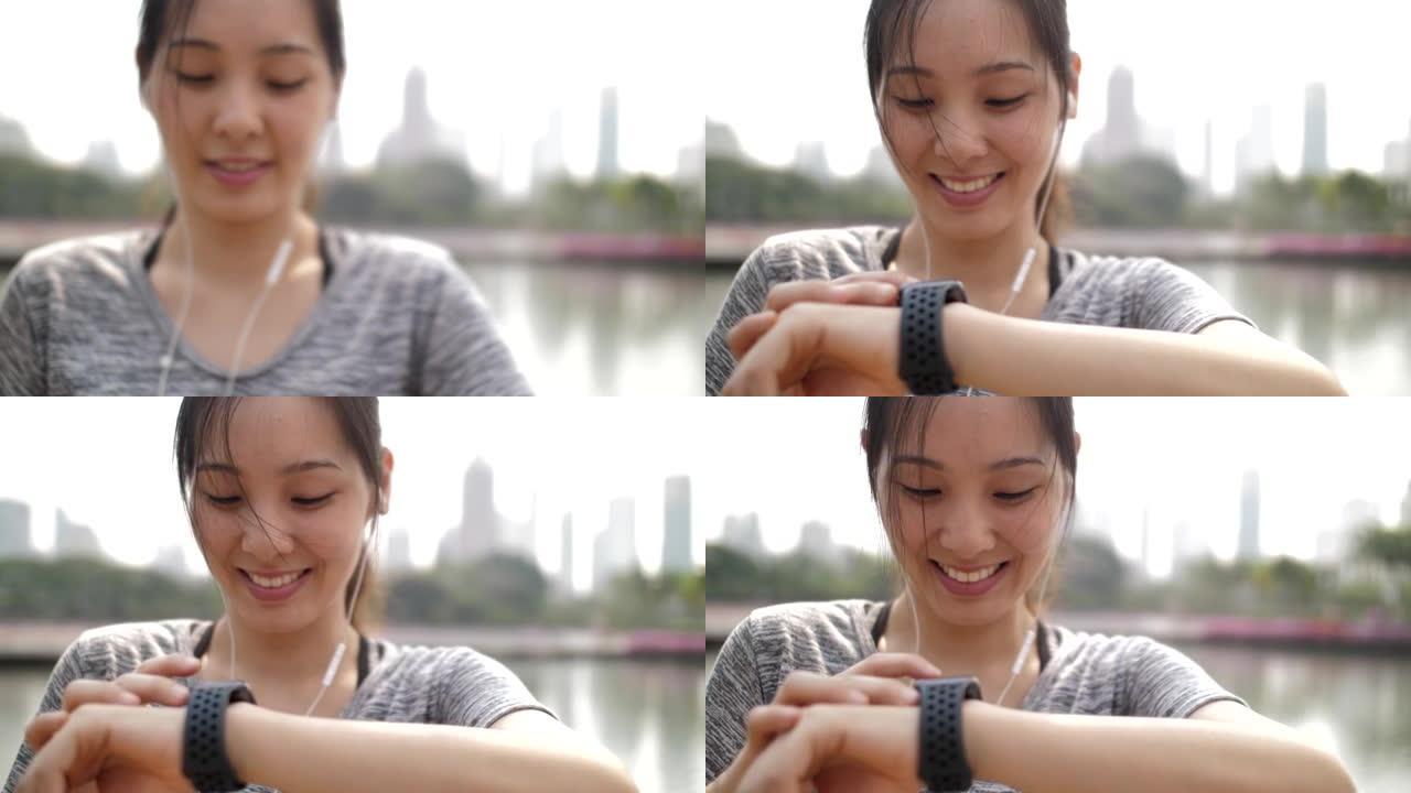 女人使用智能手表监控她在智能手表上的跑步表现