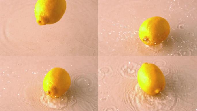 柠檬在潮湿的白色表面上落下并旋转