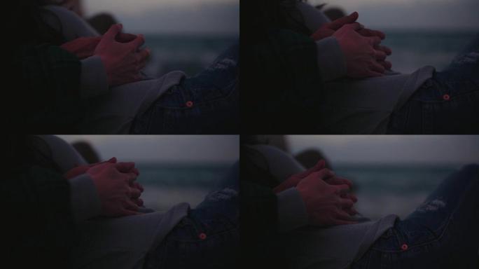 浪漫的情侣拥抱和牵手在海边