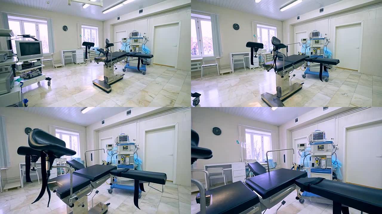 带有专业设备和检查椅的产科病房的侧视图