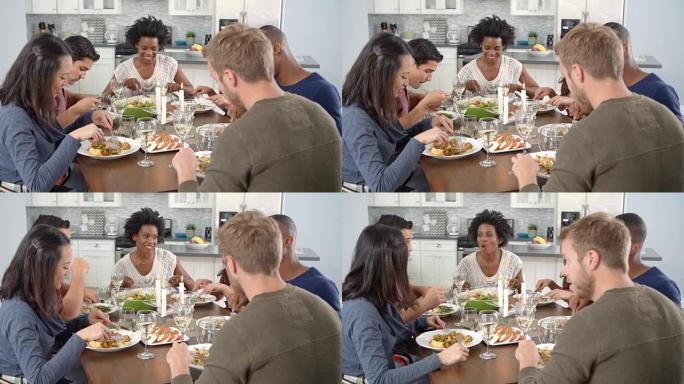 朋友在餐桌上聊天和吃饭，在R3D上拍摄