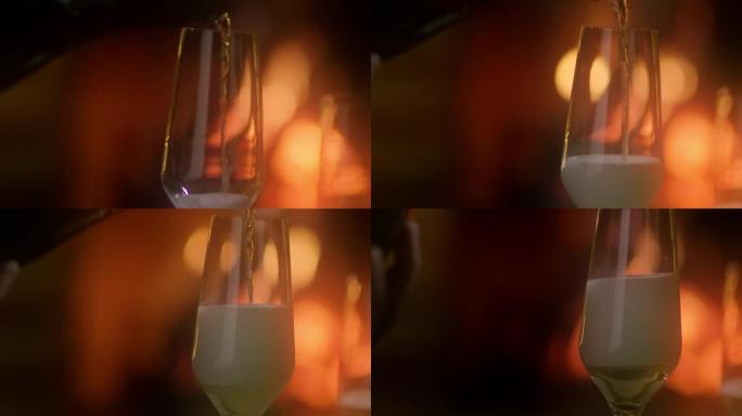SLO MO在壁炉旁将起泡酒倒入玻璃杯中