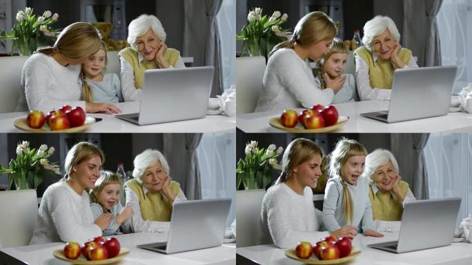 快乐的女人和小女孩视频在笔记本电脑上通话