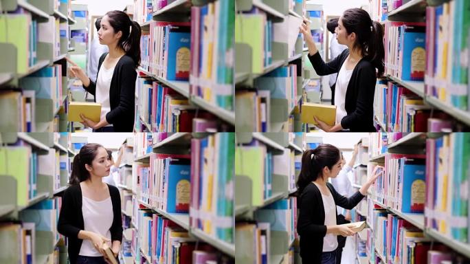 十几岁的女孩在图书馆选书。