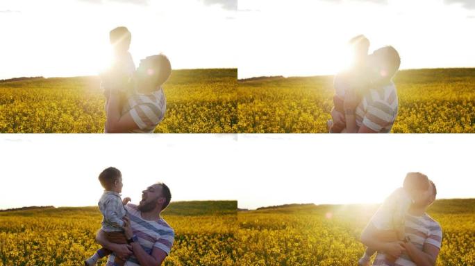 日落时，父亲和儿子在田野里玩耍。慢mo