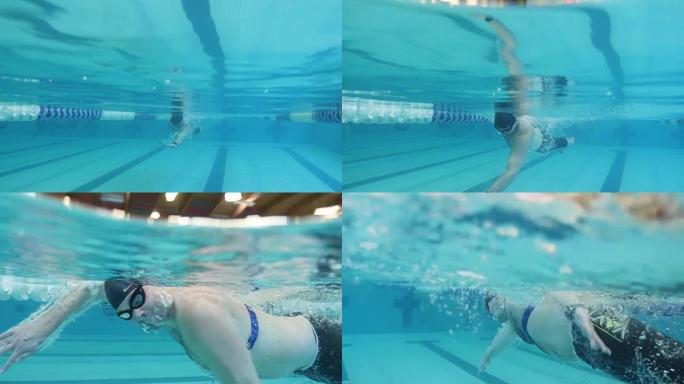 水下: 男子游泳经过相机