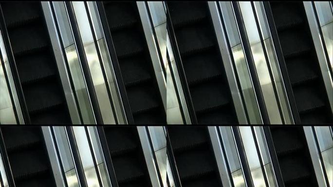 从上方看空的自动扶梯：无尽的循环