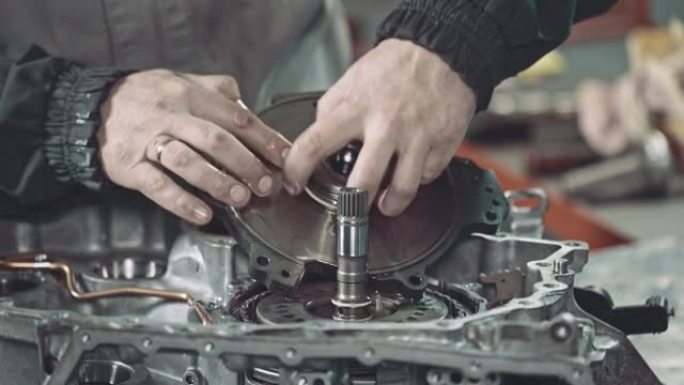 Professional mechanic repairing a continuously var