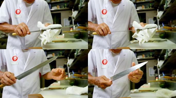 4k厨房用抹布的男厨师清洁刀