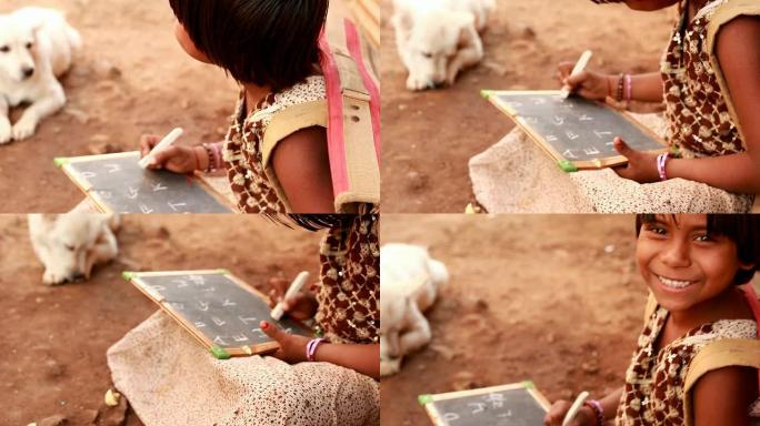 快乐的印度农村女孩写作学习ABC