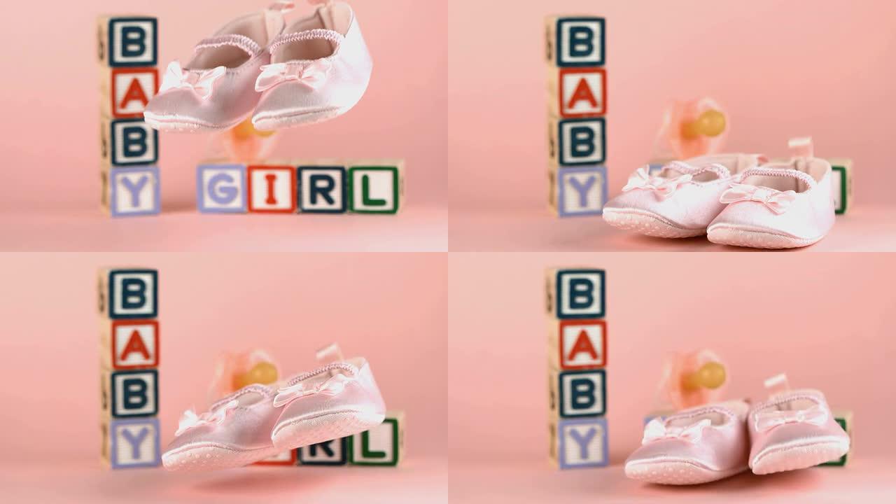 婴儿鞋落在婴儿积木和安抚用品的前面