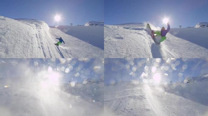 慢动作: 年轻的滑雪者在阳光明媚的雪地公园的半管中喷洒雪花