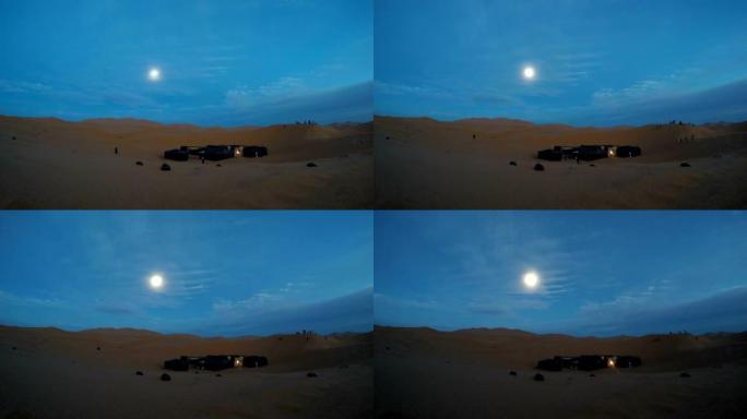 沙漠之夜。沙漠营地的景色。满月