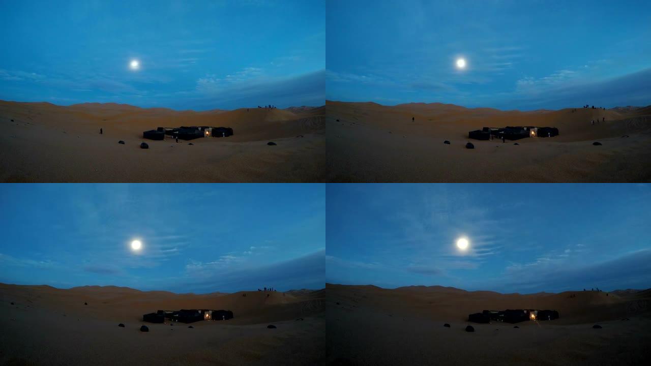 沙漠之夜。沙漠营地的景色。满月