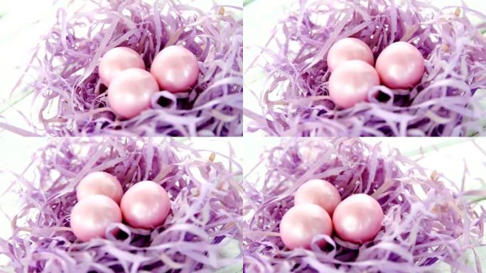 紫色巢中的粉红色复活节彩蛋