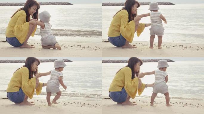 亚洲母亲带着孩子在海滩上