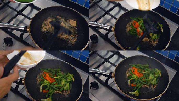 亚洲美食: 美味的平底锅炒五颜六色的新鲜蔬菜