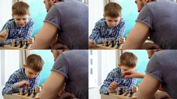 两人父子下棋的特写镜头，思考下一步行动和船上移动棋子。智力爱好和幸福的家庭观念。