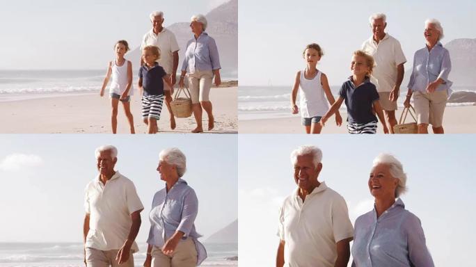 祖父母和孙子带着野餐篮沿着海滩散步