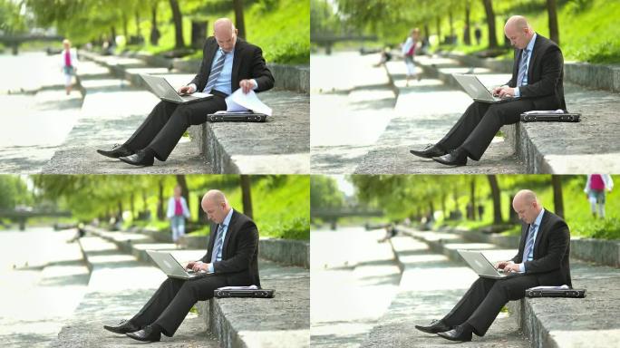 高清: 经理在河边处理文书工作