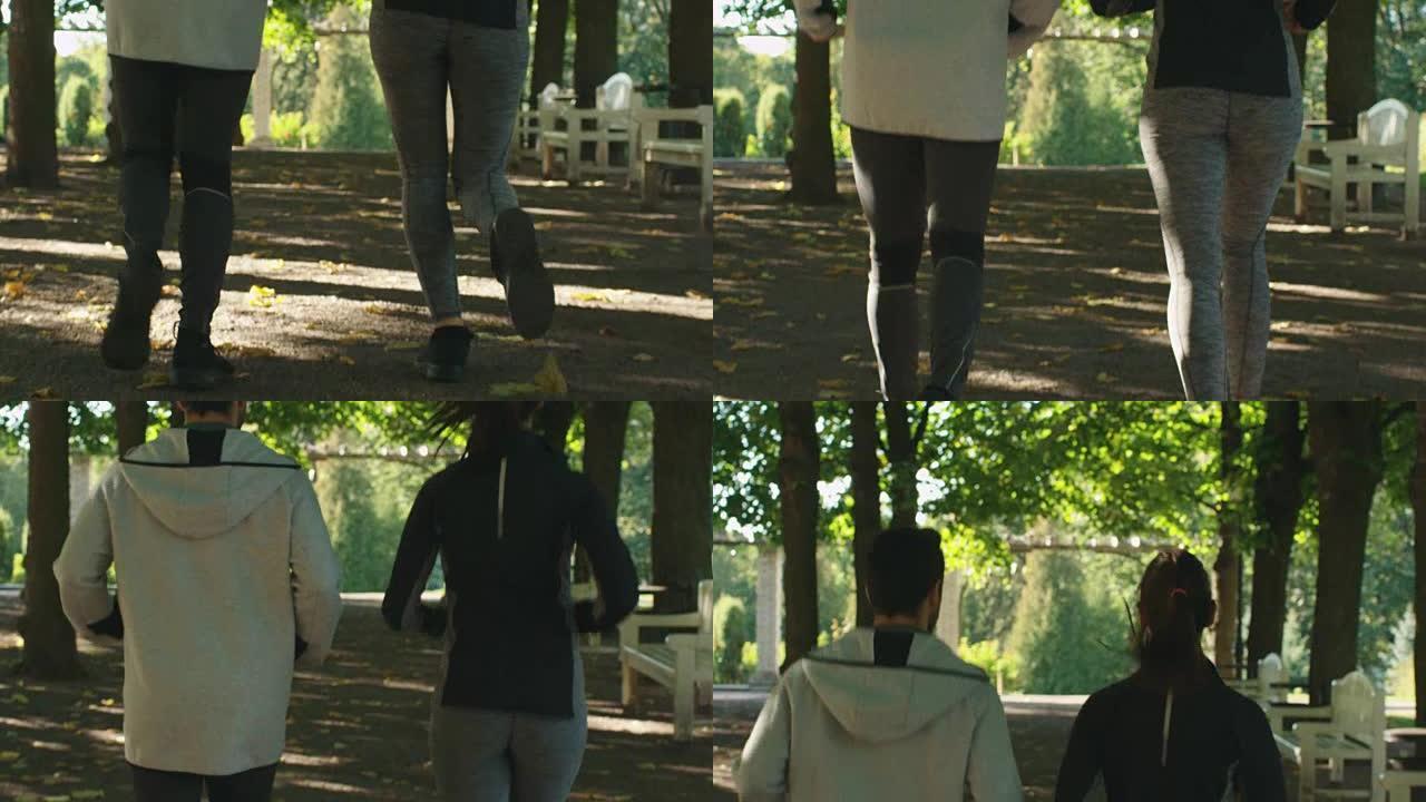 在阳光明媚的日子里，年轻的男人和女人在公园里一起跑步的镜头。