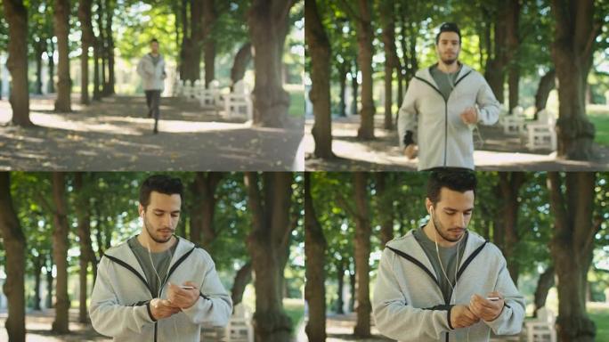 年轻帅哥在户外跑步时使用手机。