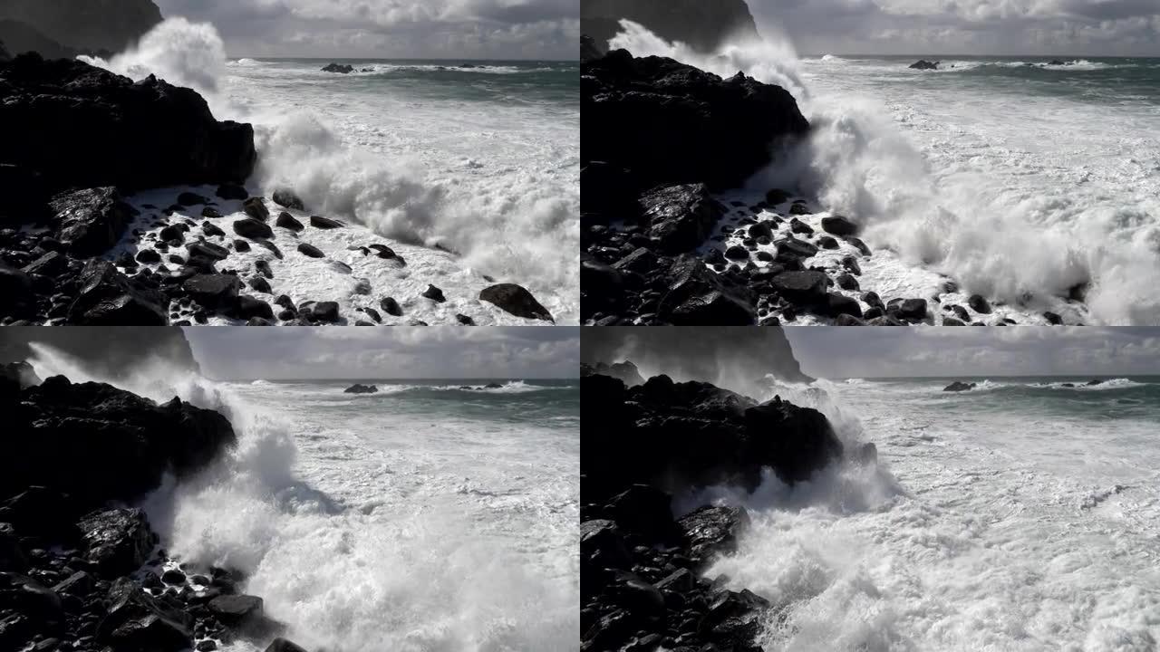 汹涌的海浪在高高的岩石露头上漂移。慢动作镜头