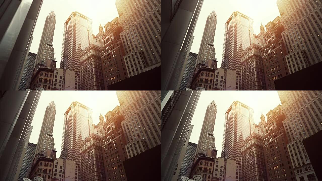 纽约市大型现代摩天大楼的低角度移动镜头。美国的城市景观。