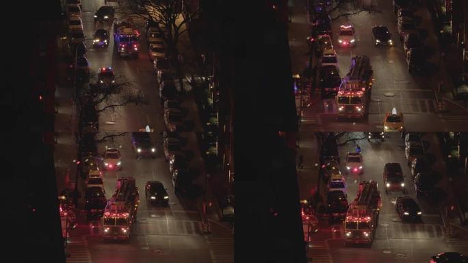 晚上站在城市街道上的消防车的鸟瞰图。汽车、交通、警示灯