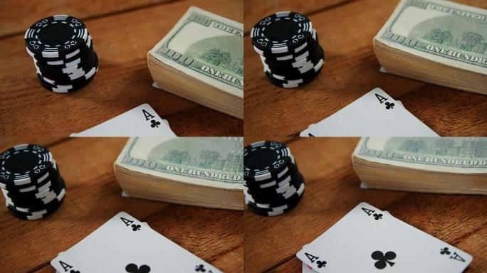扑克桌4k上扑克牌、美元和赌场筹码的特写