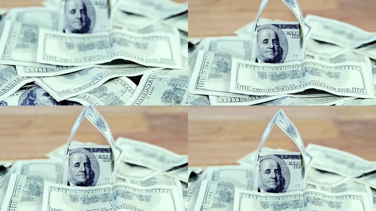 许多美元钞票散落在桌子上