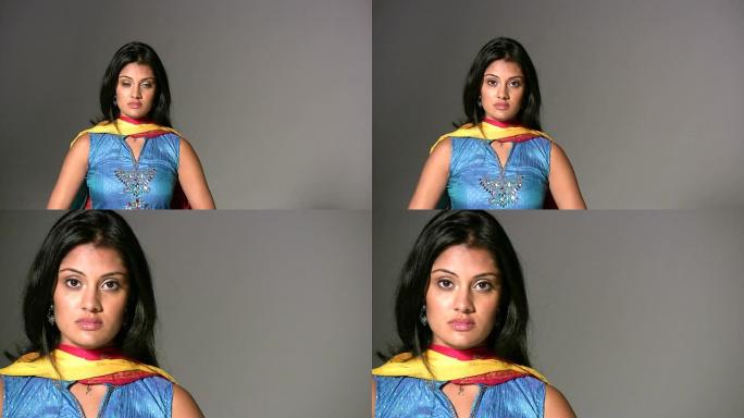 （HD1080i）印度女性看相机，屏幕左侧，放大