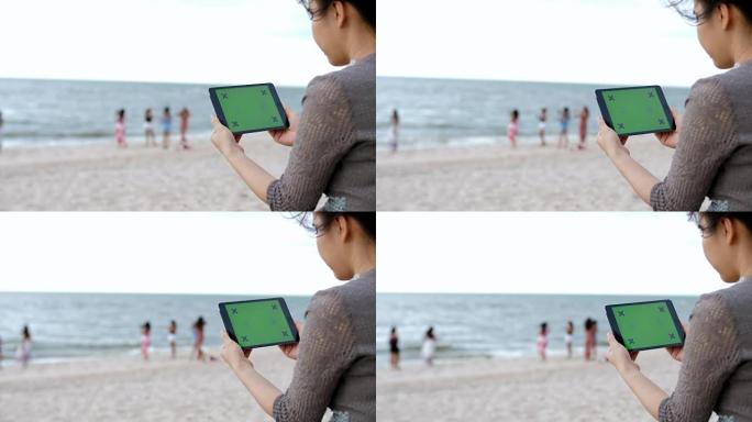 海滩上的绿色屏幕