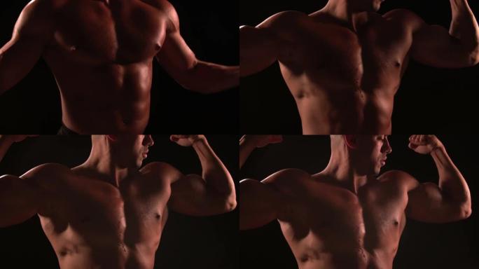 男性健美运动员看着他弯曲的肌肉，特写