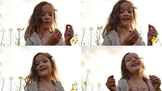 站在田野里摘花的小女孩