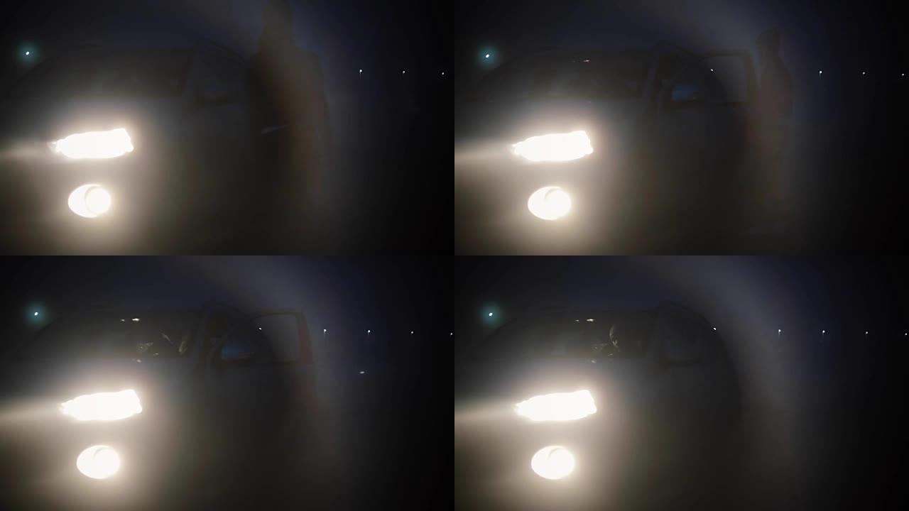 抽象的观点。女性晚上上了一辆车。模糊的暗雾公路背景拍摄神秘冒险