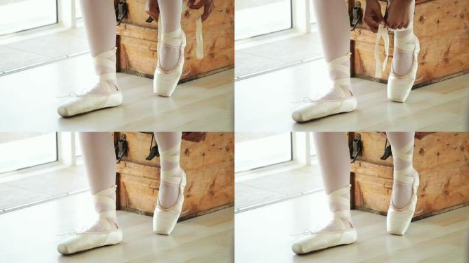 芭蕾舞演员穿上鞋子