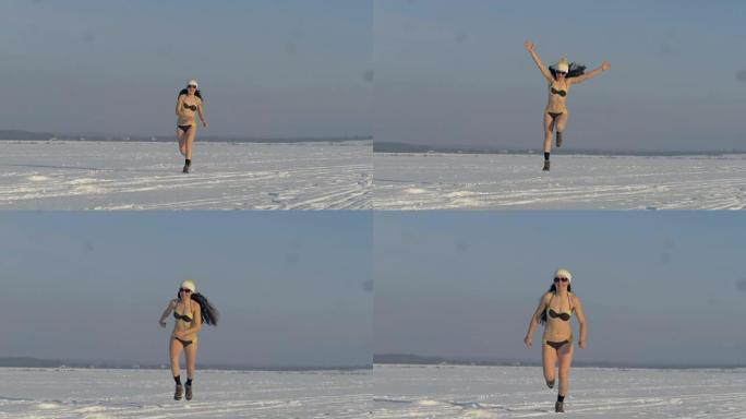 一个穿着泳衣的女人在下雪天奔跑和跳跃。