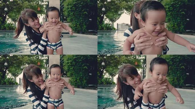 亚洲母亲和孩子在游泳池里玩得开心