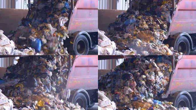 4K.卡车将废物卸载到垃圾填埋场。