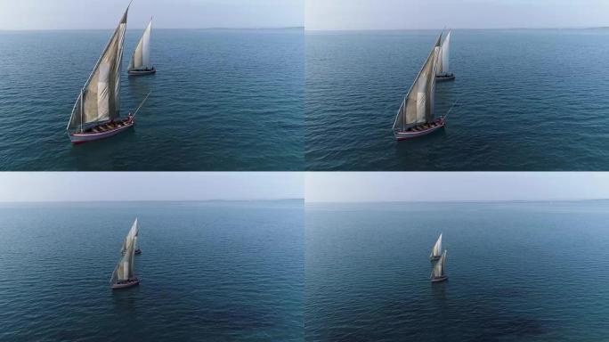 两艘传统单桅帆船在美丽风景秀丽的河口上的空中特写视图