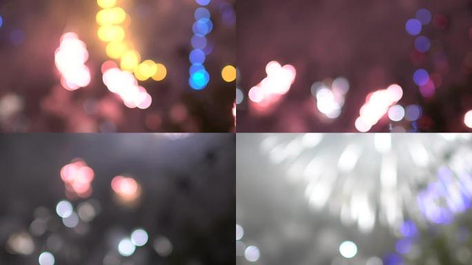 夜城街上新年庆典烟花中的彩色bokeh灯慢动作。摘要背景